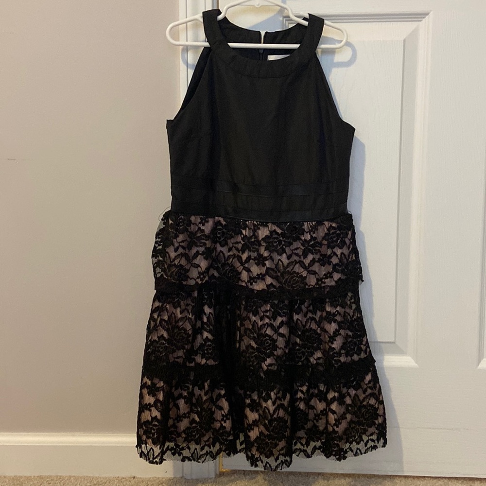 New, never worn BCBG girls dress. Size 12 youth. Black with floral lace